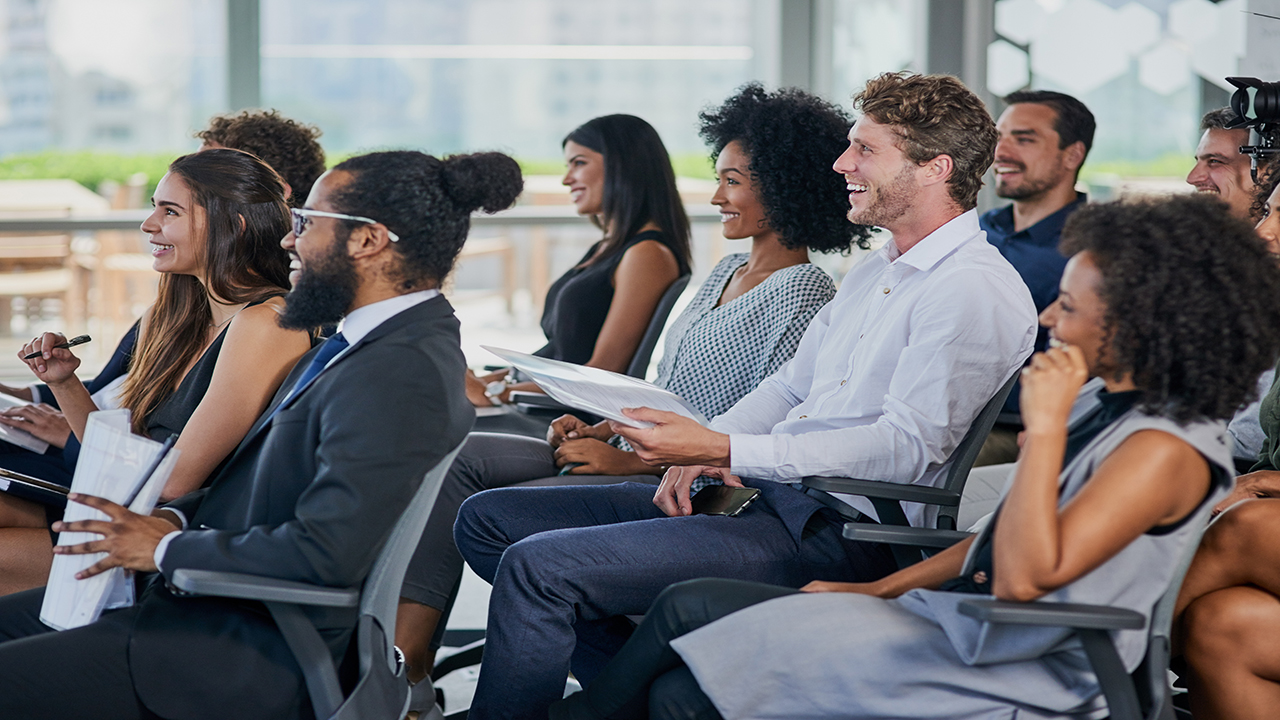 a group of business people learning