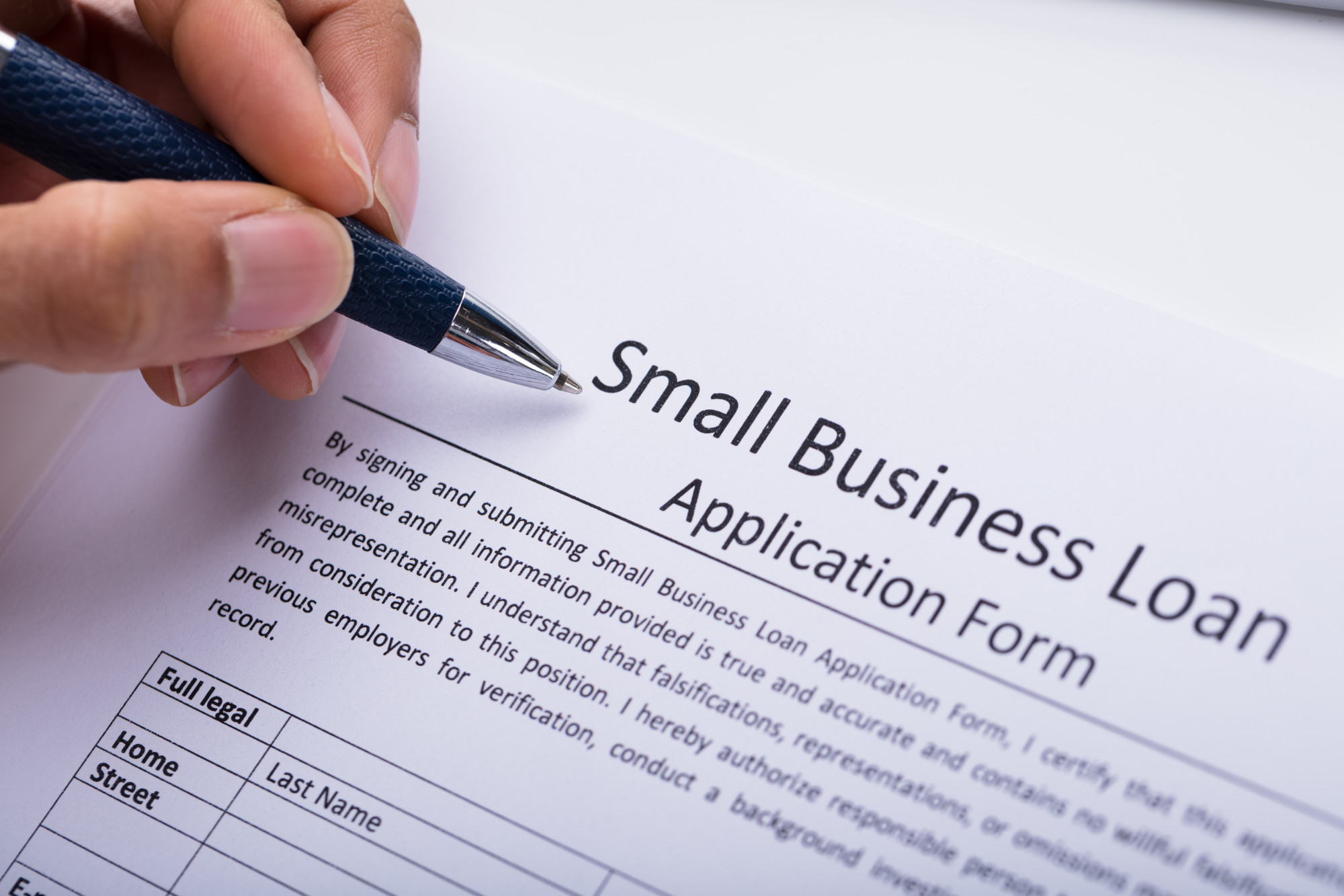 man filling out loan application