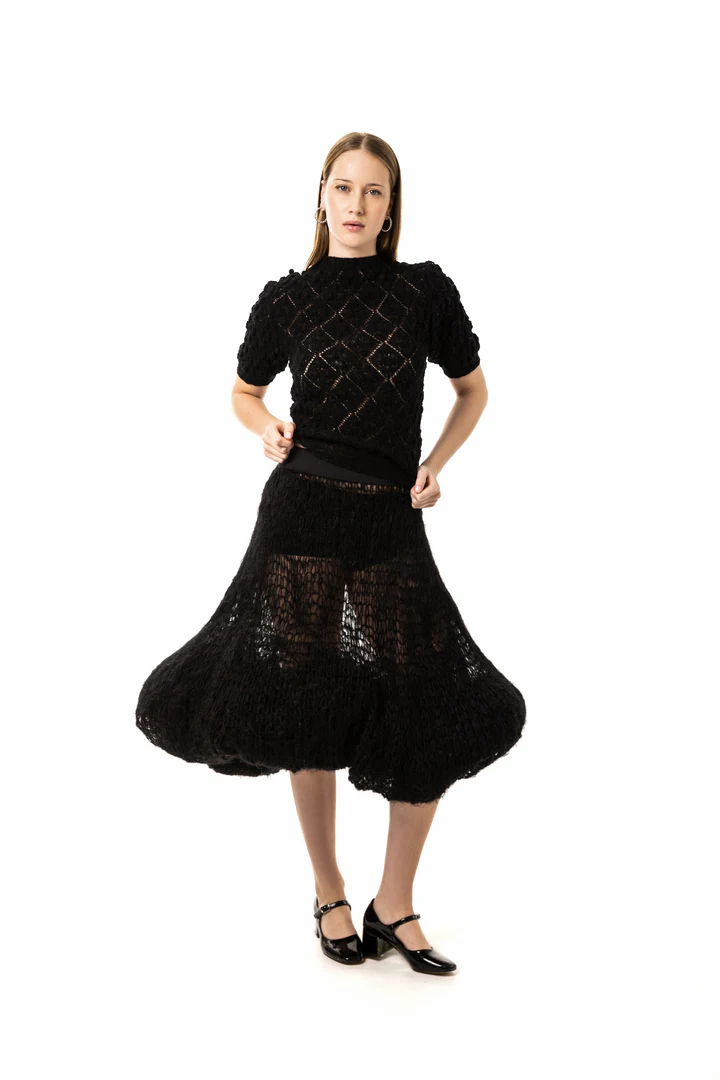Woman in a black knitted dress